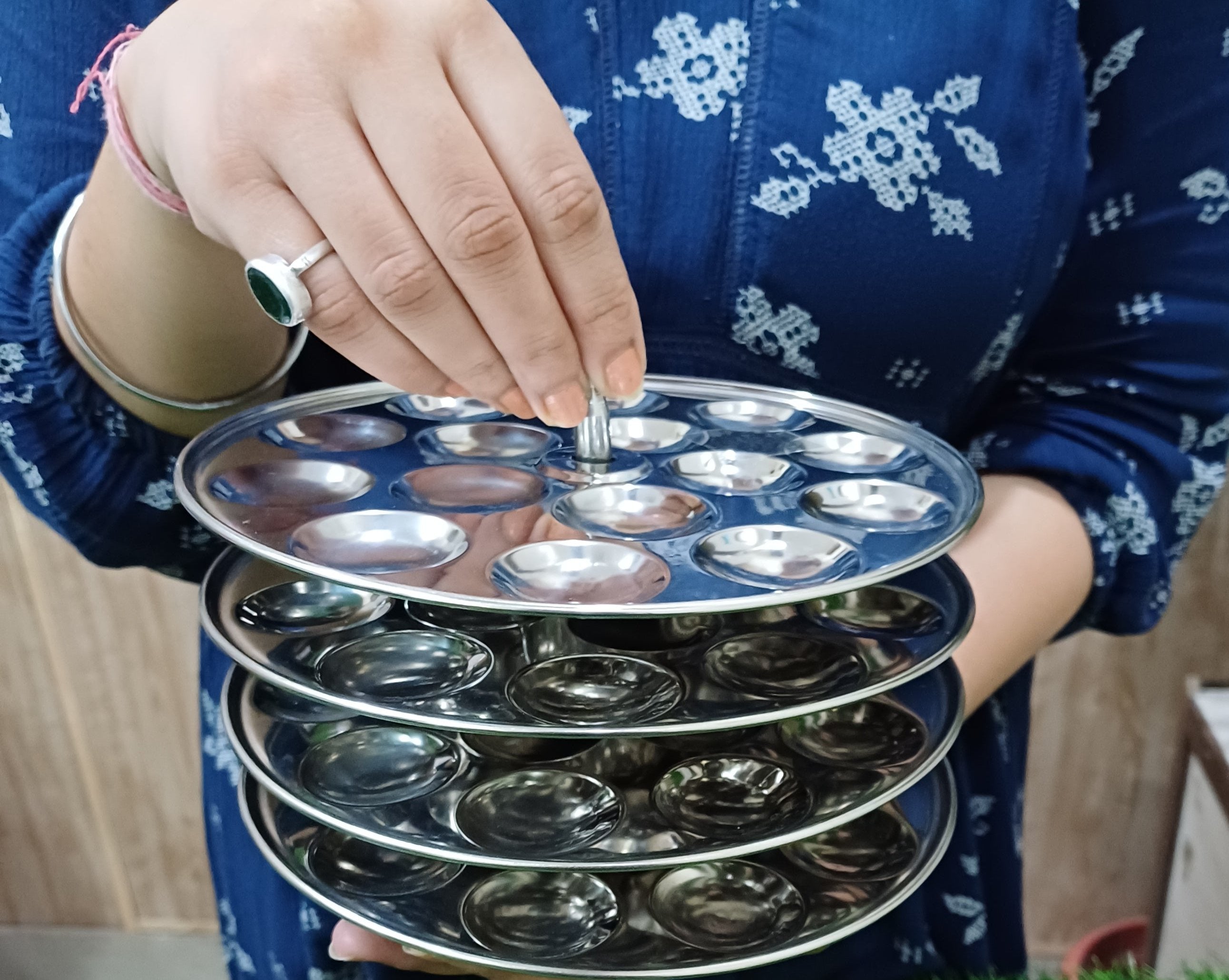 showing Stainless Steel Mini Idli Stand (15 Idli per Plate)