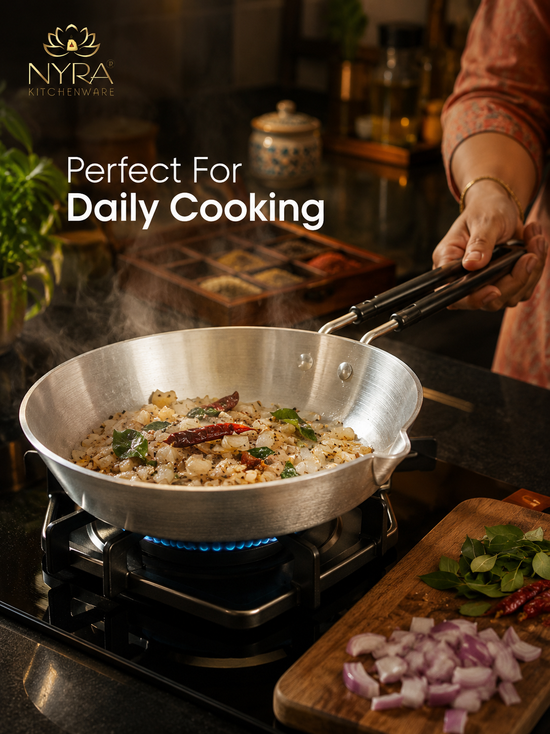 Person cooking food in a silver pan on a stove with Nyra Kitchenware branding.