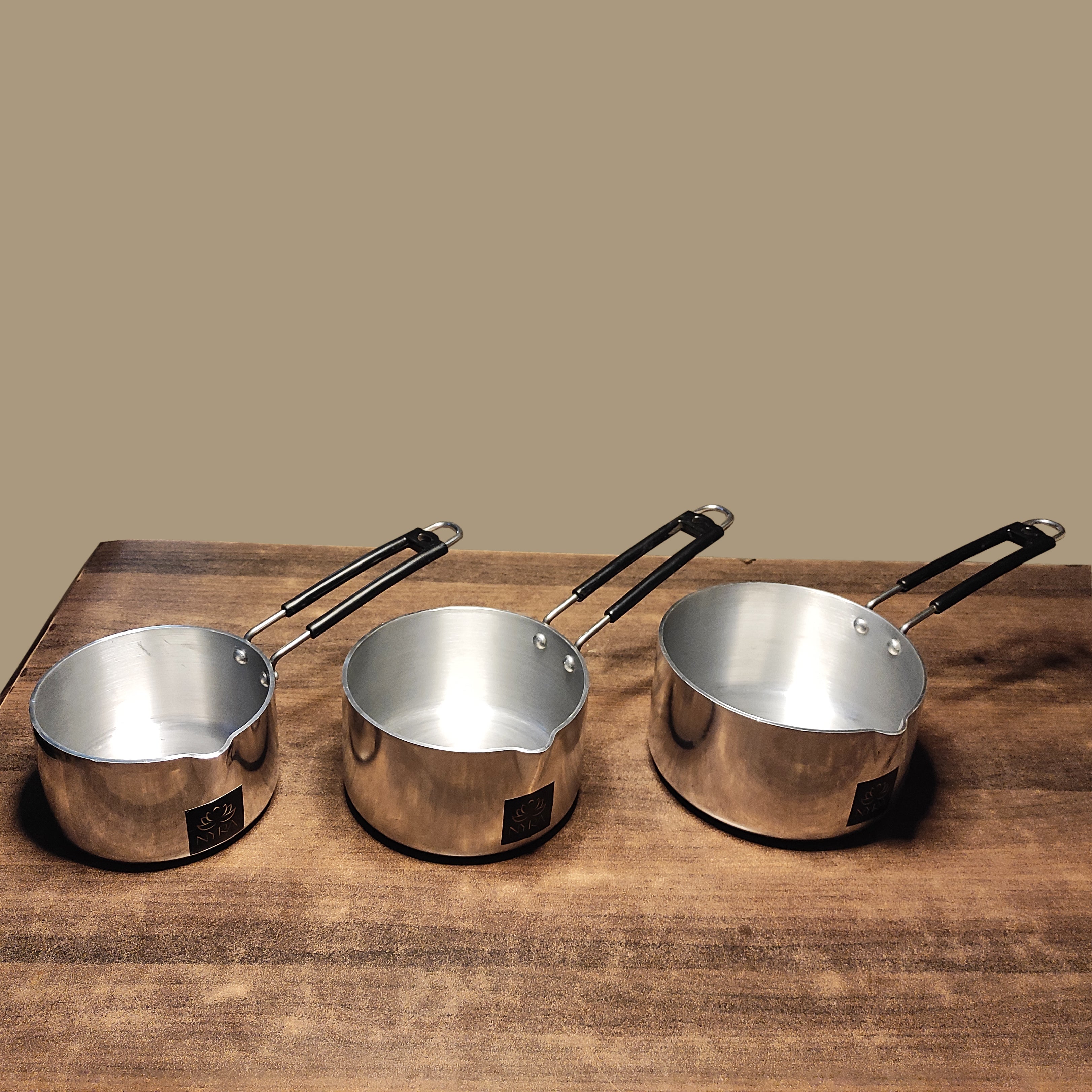 three sizes of induction sauce pan
