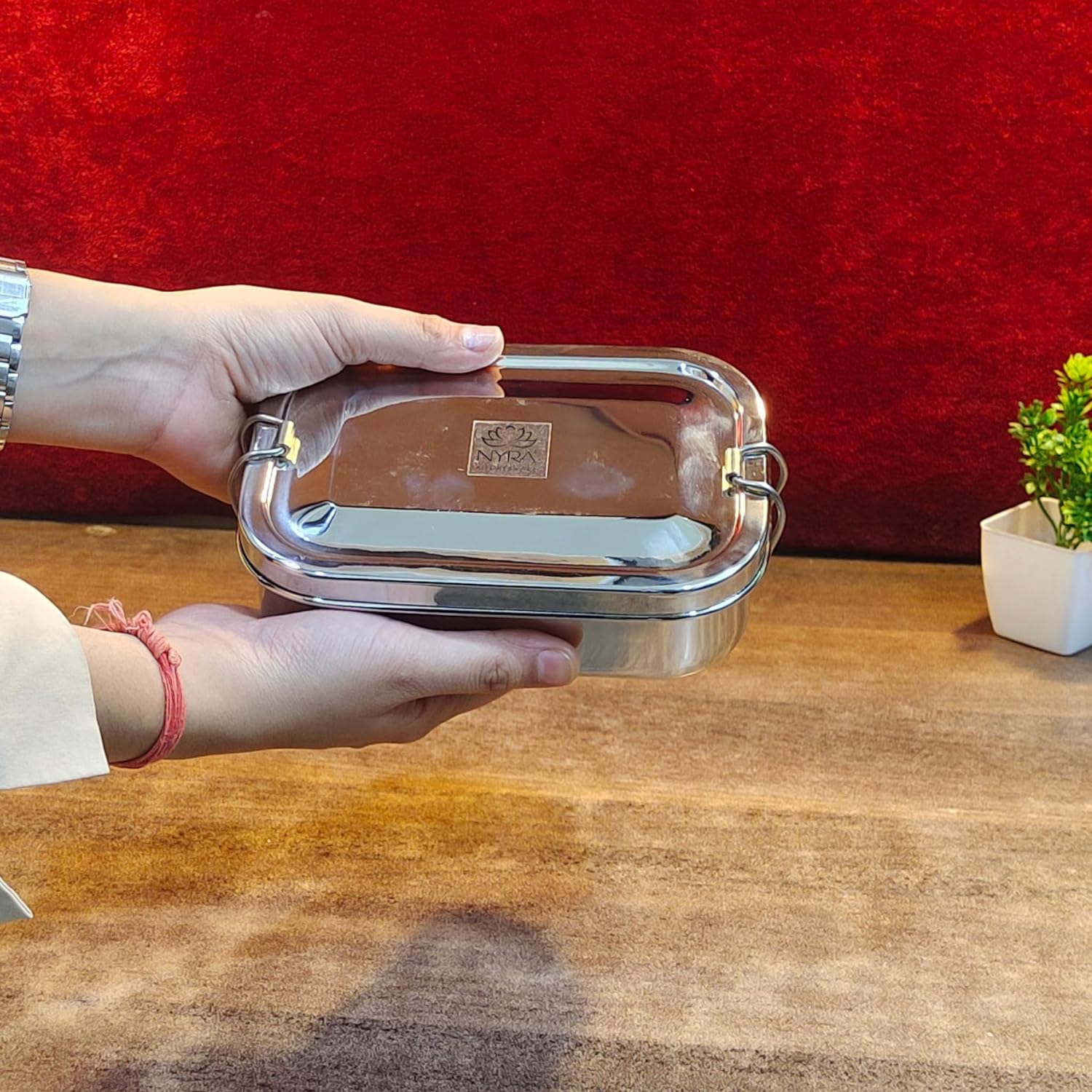 in hand view of Stainless Steel Lunch Box with Locking Clip